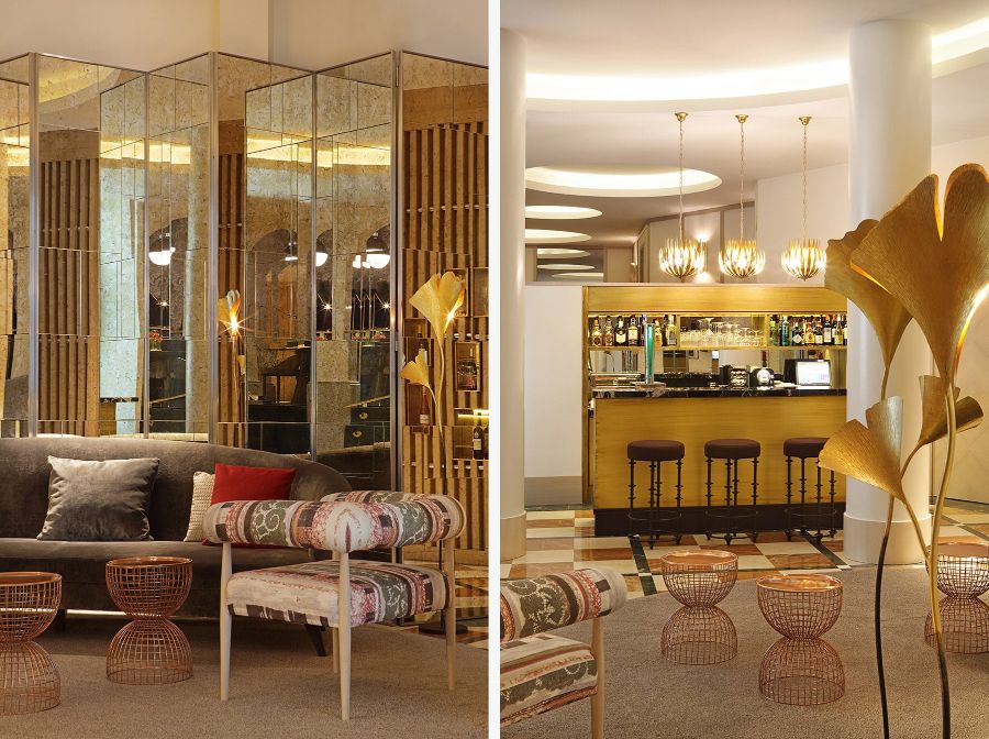 golden decorative elements, bar, brown bar stools, golden suspension lamps, grey sofa, mirror walls