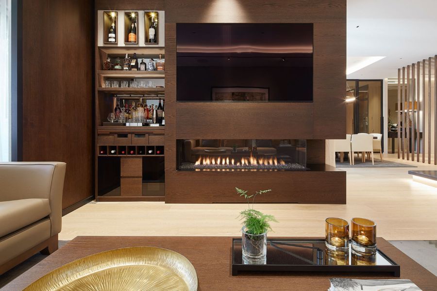 brown mini bar, tv and fireplace